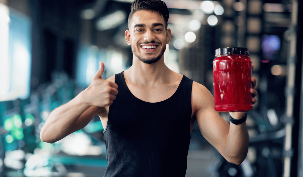 Happy man with fitness supplement